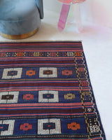 Vintage kilim rug in living room setting, old rug, antique rug, pastel colors, faded colors, Turkish rug, vintage rug, soft rug, Portland, Oregon, rug store, rug shop, local shop, earthy tones, earthy colors, warm colors