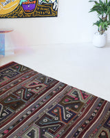 Vintage kilim rug in living room setting, bright colors, wild shaman, soft rug, bold color, Portland, Oregon, rug store, rug shop, local shop, vintage rug, modern kilim, warm colors, antique kilim rug