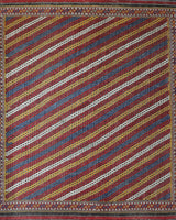 Vintage kilim rug in living room setting, old rug, antique rug, pastel colors, faded colors, Turkish rug, vintage rug, soft rug, Portland, Oregon, rug store, rug shop, local shop, earthy tones, earthy colors, warm colors