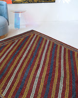 Vintage kilim rug in living room setting, old rug, antique rug, pastel colors, faded colors, Turkish rug, vintage rug, soft rug, Portland, Oregon, rug store, rug shop, local shop, earthy tones, earthy colors, warm colors