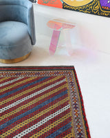 Vintage kilim rug in living room setting, old rug, antique rug, pastel colors, faded colors, Turkish rug, vintage rug, soft rug, Portland, Oregon, rug store, rug shop, local shop, earthy tones, earthy colors, warm colors