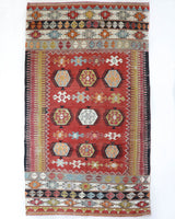 Vintage kilim rug in living room setting, bright colors, wild shaman, soft rug, bold color, Portland, Oregon, rug store, rug shop, local shop, vintage rug, modern kilim, warm colors, antique kilim rug