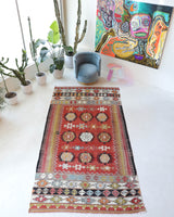 Vintage kilim rug in living room setting, bright colors, wild shaman, soft rug, bold color, Portland, Oregon, rug store, rug shop, local shop, vintage rug, modern kilim, warm colors, antique kilim rug