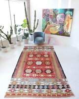 Vintage kilim rug in living room setting, bright colors, wild shaman, soft rug, bold color, Portland, Oregon, rug store, rug shop, local shop, vintage rug, modern kilim, warm colors, antique kilim rug