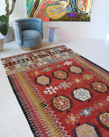 Vintage kilim rug in living room setting, bright colors, wild shaman, soft rug, bold color, Portland, Oregon, rug store, rug shop, local shop, vintage rug, modern kilim, warm colors, antique kilim rug