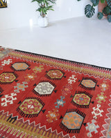 Vintage kilim rug in living room setting, bright colors, wild shaman, soft rug, bold color, Portland, Oregon, rug store, rug shop, local shop, vintage rug, modern kilim, warm colors, antique kilim rug
