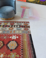 Vintage kilim rug in living room setting, bright colors, wild shaman, soft rug, bold color, Portland, Oregon, rug store, rug shop, local shop, vintage rug, modern kilim, warm colors, antique kilim rug