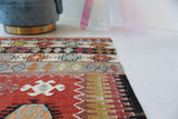 Vintage kilim rug in living room setting, bright colors, wild shaman, soft rug, bold color, Portland, Oregon, rug store, rug shop, local shop, vintage rug, modern kilim, warm colors, antique kilim rug