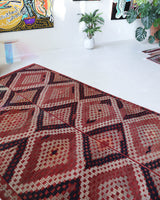 Vintage kilim rug in living room setting, old rug, antique rug, pastel colors, faded colors, Turkish rug, vintage rug, soft rug, Portland, Oregon, rug store, rug shop, local shop, earthy tones, earthy colors, warm colors