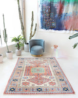 Vintage Turkish rug in living room setting, old rug, antique rug, pastel colors, faded colors, Turkish rug, vintage rug, soft rug, Portland, Oregon, rug store, rug shop, local shop