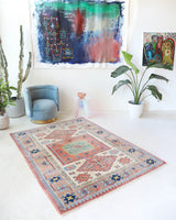 Vintage Turkish rug in living room setting, old rug, antique rug, pastel colors, faded colors, Turkish rug, vintage rug, soft rug, Portland, Oregon, rug store, rug shop, local shop