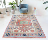 Vintage Turkish rug in living room setting, old rug, antique rug, pastel colors, faded colors, Turkish rug, vintage rug, soft rug, Portland, Oregon, rug store, rug shop, local shop