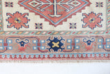 Vintage Turkish rug in living room setting, old rug, antique rug, pastel colors, faded colors, Turkish rug, vintage rug, soft rug, Portland, Oregon, rug store, rug shop, local shop
