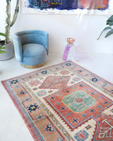 Vintage Turkish rug in living room setting, old rug, antique rug, pastel colors, faded colors, Turkish rug, vintage rug, soft rug, Portland, Oregon, rug store, rug shop, local shop