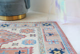 Vintage Turkish rug in living room setting, old rug, antique rug, pastel colors, faded colors, Turkish rug, vintage rug, soft rug, Portland, Oregon, rug store, rug shop, local shop