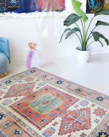 Vintage Turkish rug in living room setting, old rug, antique rug, pastel colors, faded colors, Turkish rug, vintage rug, soft rug, Portland, Oregon, rug store, rug shop, local shop