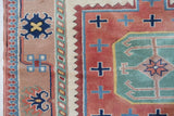 Vintage Turkish rug in living room setting, old rug, antique rug, pastel colors, faded colors, Turkish rug, vintage rug, soft rug, Portland, Oregon, rug store, rug shop, local shop