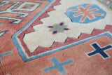 Vintage Turkish rug in living room setting, old rug, antique rug, pastel colors, faded colors, Turkish rug, vintage rug, soft rug, Portland, Oregon, rug store, rug shop, local shop