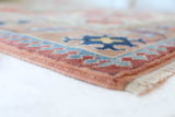 Vintage Turkish rug in living room setting, old rug, antique rug, pastel colors, faded colors, Turkish rug, vintage rug, soft rug, Portland, Oregon, rug store, rug shop, local shop