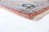 Vintage Turkish rug in living room setting, old rug, antique rug, pastel colors, faded colors, Turkish rug, vintage rug, soft rug, Portland, Oregon, rug store, rug shop, local shop