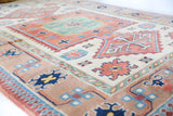 Vintage Turkish rug in living room setting, old rug, antique rug, pastel colors, faded colors, Turkish rug, vintage rug, soft rug, Portland, Oregon, rug store, rug shop, local shop