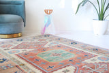 Vintage Turkish rug in living room setting, old rug, antique rug, pastel colors, faded colors, Turkish rug, vintage rug, soft rug, Portland, Oregon, rug store, rug shop, local shop