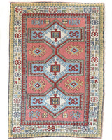 Vintage Turkish rug in living room setting, old rug, antique rug, pastel colors, faded colors, Turkish rug, vintage rug, soft rug, Portland, Oregon, rug store, rug shop, local shop