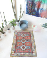 Vintage Turkish rug in living room setting, old rug, antique rug, pastel colors, faded colors, Turkish rug, vintage rug, soft rug, Portland, Oregon, rug store, rug shop, local shop