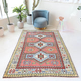 Vintage Turkish rug in living room setting, old rug, antique rug, pastel colors, faded colors, Turkish rug, vintage rug, soft rug, Portland, Oregon, rug store, rug shop, local shop