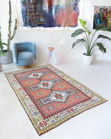 Vintage Turkish rug in living room setting, old rug, antique rug, pastel colors, faded colors, Turkish rug, vintage rug, soft rug, Portland, Oregon, rug store, rug shop, local shop