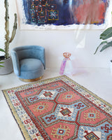 Vintage Turkish rug in living room setting, old rug, antique rug, pastel colors, faded colors, Turkish rug, vintage rug, soft rug, Portland, Oregon, rug store, rug shop, local shop