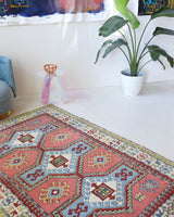 Vintage Turkish rug in living room setting, old rug, antique rug, pastel colors, faded colors, Turkish rug, vintage rug, soft rug, Portland, Oregon, rug store, rug shop, local shop
