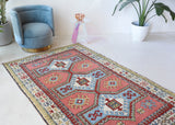 Vintage Turkish rug in living room setting, old rug, antique rug, pastel colors, faded colors, Turkish rug, vintage rug, soft rug, Portland, Oregon, rug store, rug shop, local shop