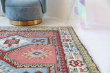 Vintage Turkish rug in living room setting, old rug, antique rug, pastel colors, faded colors, Turkish rug, vintage rug, soft rug, Portland, Oregon, rug store, rug shop, local shop