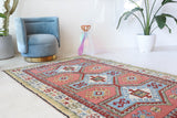 Vintage Turkish rug in living room setting, old rug, antique rug, pastel colors, faded colors, Turkish rug, vintage rug, soft rug, Portland, Oregon, rug store, rug shop, local shop