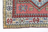Vintage Turkish rug in living room setting, old rug, antique rug, pastel colors, faded colors, Turkish rug, vintage rug, soft rug, Portland, Oregon, rug store, rug shop, local shop