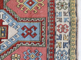 Vintage Turkish rug in living room setting, old rug, antique rug, pastel colors, faded colors, Turkish rug, vintage rug, soft rug, Portland, Oregon, rug store, rug shop, local shop