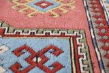 Vintage Turkish rug in living room setting, old rug, antique rug, pastel colors, faded colors, Turkish rug, vintage rug, soft rug, Portland, Oregon, rug store, rug shop, local shop