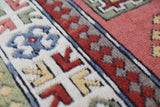 Vintage Turkish rug in living room setting, old rug, antique rug, pastel colors, faded colors, Turkish rug, vintage rug, soft rug, Portland, Oregon, rug store, rug shop, local shop