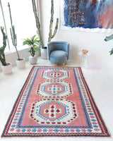 Vintage Turkish rug in a living room setting, pile rug, Turkish rug, vintage rug, portland, rug shop, bright colors, wild shaman, soft rug, bold color, Portland, Oregon, rug store, rug shop, local shop, antique rug