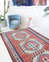 Vintage Turkish rug in a living room setting, pile rug, Turkish rug, vintage rug, portland, rug shop, bright colors, wild shaman, soft rug, bold color, Portland, Oregon, rug store, rug shop, local shop, antique rug