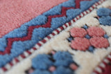 Vintage Turkish rug in a living room setting, pile rug, Turkish rug, vintage rug, portland, rug shop, bright colors, wild shaman, soft rug, bold color, Portland, Oregon, rug store, rug shop, local shop, antique rug