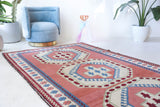 Vintage Turkish rug in a living room setting, pile rug, Turkish rug, vintage rug, portland, rug shop, bright colors, wild shaman, soft rug, bold color, Portland, Oregon, rug store, rug shop, local shop, antique rug
