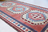 Vintage Turkish rug in a living room setting, pile rug, Turkish rug, vintage rug, portland, rug shop, bright colors, wild shaman, soft rug, bold color, Portland, Oregon, rug store, rug shop, local shop, antique rug