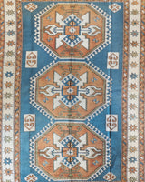 Vintage Turkish rug in living room setting, old rug, antique rug, pastel colors, faded colors, Turkish rug, vintage rug, soft rug, Portland, Oregon, rug store, rug shop, local shop