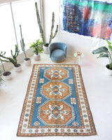 Vintage Turkish rug in living room setting, old rug, antique rug, pastel colors, faded colors, Turkish rug, vintage rug, soft rug, Portland, Oregon, rug store, rug shop, local shop