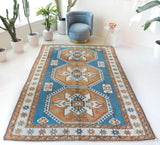 Vintage Turkish rug in living room setting, old rug, antique rug, pastel colors, faded colors, Turkish rug, vintage rug, soft rug, Portland, Oregon, rug store, rug shop, local shop