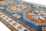 Vintage Turkish rug in living room setting, old rug, antique rug, pastel colors, faded colors, Turkish rug, vintage rug, soft rug, Portland, Oregon, rug store, rug shop, local shop