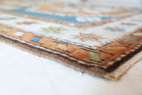 Vintage Turkish rug in living room setting, old rug, antique rug, pastel colors, faded colors, Turkish rug, vintage rug, soft rug, Portland, Oregon, rug store, rug shop, local shop