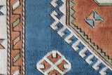 Vintage Turkish rug in living room setting, old rug, antique rug, pastel colors, faded colors, Turkish rug, vintage rug, soft rug, Portland, Oregon, rug store, rug shop, local shop